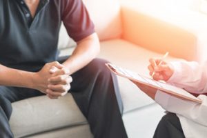 Man discussing vasectomy procedure with urologist in melbourne